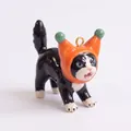Close-up view of a cute ceramic cat charm wearing an orange fruit hat for DIY jewelry - Pendant Only / Clown Cat Pendant
