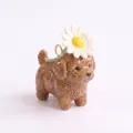 Detailed view of ceramic brown poodle pendant with a white daisy flower on its head - White Daisy Teddy Pendant (MQPK262714KI) / Pendant Only