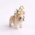 Detailed macro shot of a ceramic French Bulldog pendant featuring white lilies - Lily of the Valley Frenchie Pendant (MQPK262714KI)