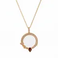 Detailed view of an elegant gold round pendant with white crystal and teardrop gems - Round Ruby ​​transparent Photo Box Necklace