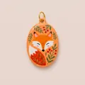 Macro view of a hand-painted enamel fox pendant featuring vibrant botanical patterns - Little Fox Oval Pendant