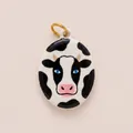 Close-up of hand-painted enamel cow pendant with glossy finish and vibrant blue eyes. - Cow Head Oval Pendant
