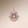 Detailed macro shot of a purple enamel flower pendant with central pearls and gold trim - February Violet Pendant Only (Without Chain)