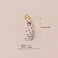 White miniature Matryoshka doll charm featuring red hearts pattern made of copper material - White Roly-Poly Figure
