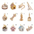 Twelve-piece set of pet-themed enamel charms with pearls and gold finish for jewelry designs - Padded Cat Bed Pendant