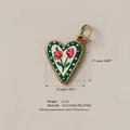 Detail view of 316 stainless steel heart pendant with rose floral pattern. - Double-headed Rose Pendant No. 3