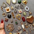 Detailed view of assorted vintage-style 18K gold plated stainless steel charms - Oval Tulip Pendant