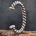 Detailed close-up showing the texture of a vintage twisted titanium steel open bangle for men - Steel Color Twisted Bangle
