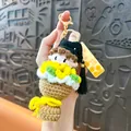 Handmade crochet graduation doll keychain featuring a sunflower bouquet and black tassel - Yellow Graduation Bouquet / Yellow