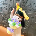Handcrafted crochet graduation doll keychain with flower bouquet and yellow tag - Exam Success Graduation Bouquet / Yellow
