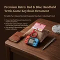 Retro mini handheld game console keychain with red and blue design for nostalgic fun - Classic Game Console Pendant / Red