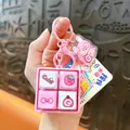 Mini llavero de juguete antiestrés con teclas mecánicas y dibujos animados rosas - Botón de Cuatro Rejillas para Niño de Cuatro Ojos / Rosa