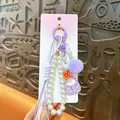 Lindo colgante de bolso de perlas moradas con cordón de perlas blancas y pompón decorativo - Púrpura
