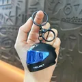 Portachiavi mini casco da moto creativo con visiera blu e funzione di luce LED luminosa - Ciondolo Casco Colorato (Non Luminoso) / Nero