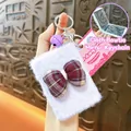 Portable white plush keychain with a red plaid bow and hidden folding makeup mirror. - Bowknot Folding Mirror Pendant / Purple