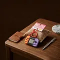 Retro mini handheld game console keychain in vibrant orange and purple colors - Classic Game Console Pendant / Orange