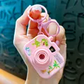 Creative pink toy camera keychain featuring a cute green dinosaur and palm tree - Pink