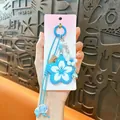 Adorable blue cherry blossom flower keychain with woven rope and decorative beads - Flower Pendant / Blue