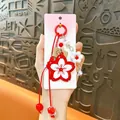 Handmade red flower alloy keychain with braided rope and bell accessory - Flower Pendant / Red