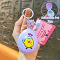 Purple egg-shaped electronic pet keychain toy with a cute cartoon chicken design. - Egg Shaped Game Console Pendant / Purple