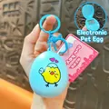 Blue egg-shaped electronic pet game keychain with cute chick illustration SKU - Egg Shaped Game Console Pendant / Blue