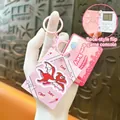 Mini pink handheld game console keychain featuring a cute dinosaur design and flip book style - Book Shaped Game Console Pendant / Pink