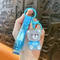 Cute blue translucent bear keychain featuring a glitter strap and a bear charm for bags - Blue