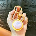 Cute pink LED glow steamed bun keychain toy with yellow ring stress relief charm - Crystal Bun / Luminous Button Charm