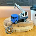 Portachiavi mini gru blu in lega con funzione di ricarica a molla per bimbi e studenti - Gru / Blu