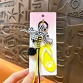 Exquisite yellow flip-flop keychain bag charm with black and white gingham bow and pom-pom - Flip-flop Pendant / Yellow
