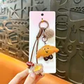 Cute croissant bread keychain with faux fur pom pom in Maillard brown style for bags - Croissant / Brown