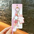 Cute pink pom-pom keychain featuring a chocolate charm and beads for bag decor - Chocolate Pompom Charm / Pink