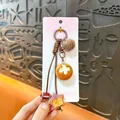 Adorable Maillard style pretzel and mini bread keychain pendant for bags and phones - Pretzel Ball / Brown