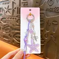 Purple acrylic starfish keychain with beaded cord and metallic bow charm accessory - Ocean Style Starfish Charm / Purple