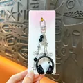 Chic black mini headphone keychain charm with silver stars and hearts on a display card - Music Headphone Pendant / Black