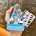 Adorable panda themed game machine squishy keychain accessory in vibrant light blue color - Panda Electronic Piano / Blue