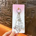 Portachiavi moda con perline argentate, cuore traforato, fiocco e ciondolo con perla - Stile Cuore / Argento