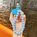 Fashionable blue AB iridescent beaded phone wristlet keychain with sweet heart charm. - Blue