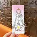 Elegante ciondolo per borsa con perline, fiocco e fiori per portachiavi alla moda - Stile Fiore / Argento