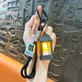 Vintage miniatuur LED-lantaarn sleutelhanger met warm licht en stevig zwart touwkoord - Retro Holle Toplamp / Zwart