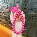 Fashionable hot pink beaded phone wristlet strap with a lovely heart charm accessory - Rose Red
