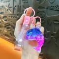Handmade liquid quicksand dolphin keychain featuring a pink and blue gradient design - Oil Injected Ocean Whale Pendant / Pink