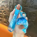 Cute blue whale liquid quicksand keychain with floral glitter and blue wrist strap - Oil Injected Ocean Whale Pendant / Blue