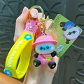 Cute cartoon panda keychain featuring yellow strap and pink hat panda charm accessory - Music Panda Keychain / Yellow