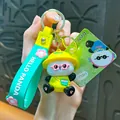Cute 3D cartoon panda keychain accessory with green silicone strap and pink flower charm - Music Panda Keychain / Green