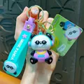 Cute cartoon music panda keychain with headphones and teal strap bag accessory - Music Panda Keychain / Blue