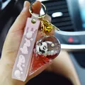 Cute panda ice cream liquid keychain with pink 'Pretty Good' strap and gold bell - Panda Ice Cream Quicksand Pendant / Red