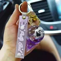 Adorable cartoon panda keychain with purple strap and clear liquid glitter charm ball - Panda Ice Cream Quicksand Pendant / Purple