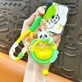 Cute cartoon panda keychain with yellow liquid star globe and green silicone strap - Panda Elf Ball Quicksand Pendant / Yellow