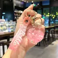 Pink heart-shaped liquid quicksand keychain with perfume bottle charm and Bubble strap - Explosive Pearl / Pink